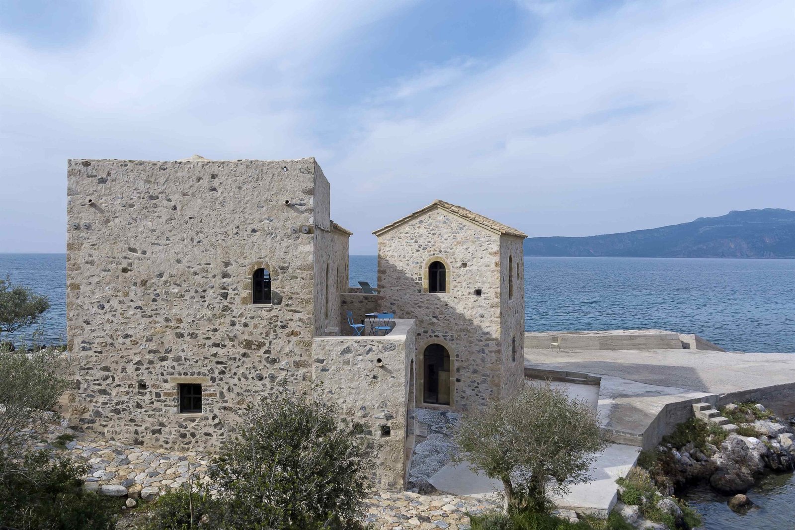 Restored stone tower and chapel-like building on the shore, the Teloneio, Kardamyli
